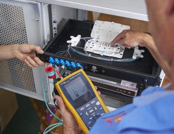 Technician installing data cabling