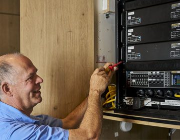 Technician installing commercvial security system
