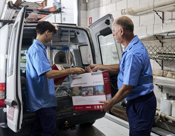 Security technicians unpacking security equipment